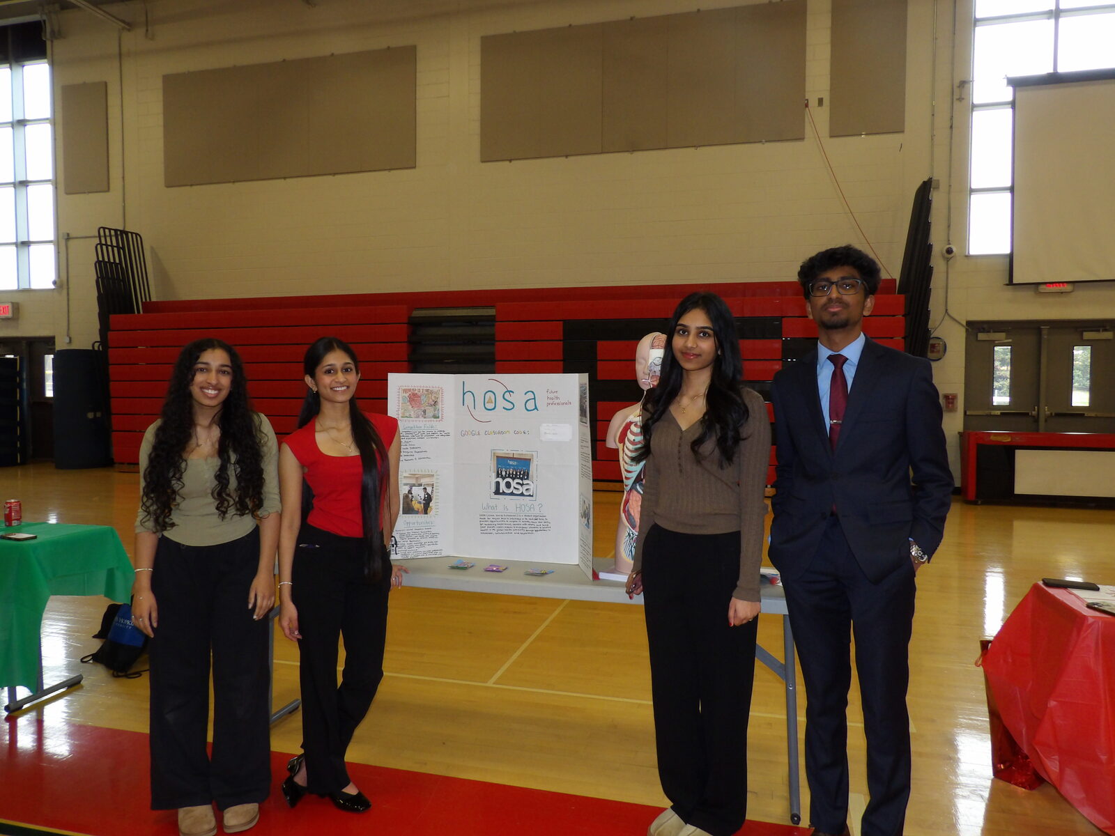 Students at the HOSA club exhibition table.